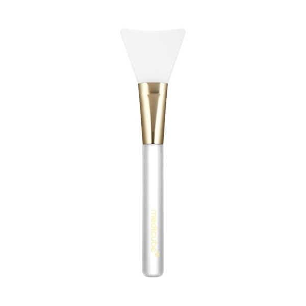 Medicube Jelly Brush aplicador facial de silicona blanco y dorado